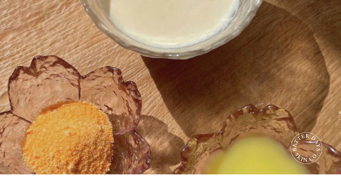 A bowl of creamy ginger milk pudding, garnished with a sprinkle of red sugar, set against a rustic background with fresh ginger and a glass of milk.