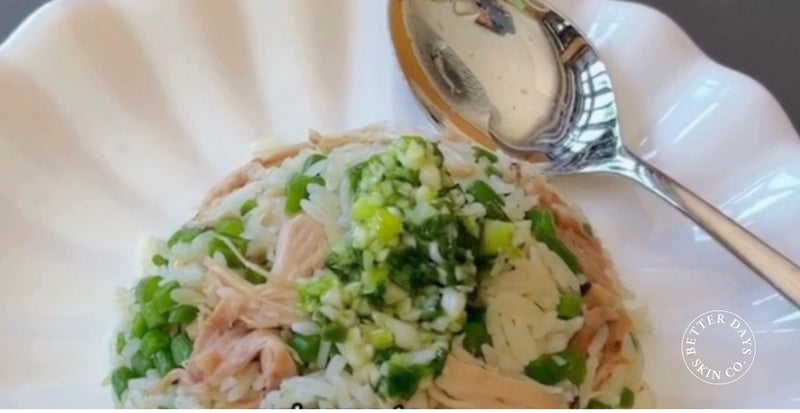 A colorful bowl of Chicken Veggie Rice, featuring shredded chicken, chopped French beans, and aromatic herbs, all beautifully garnished and ready to serve.