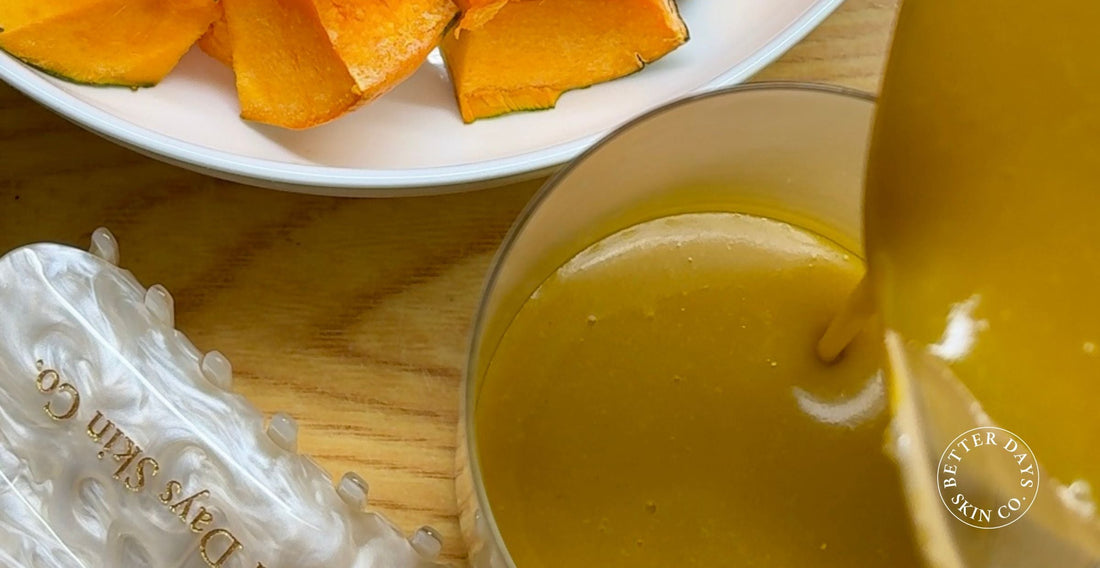 A creamy Pumpkin Smoothie in a glass, featuring a blend of sweet pumpkin and nutty millet, garnished with a sprinkle of millet.