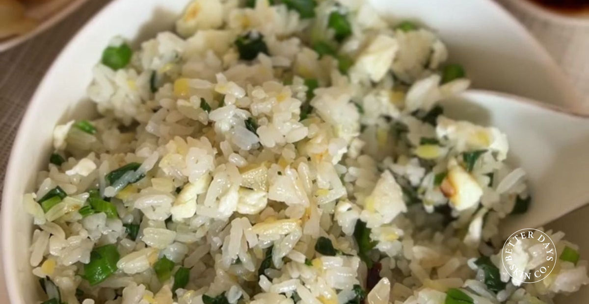 Delicious Ginger Egg White Rice with fresh vegetables, showcasing a vibrant mix of minced ginger, garlic, and gailan stems, perfect for a healthy meal inspired by Traditional Chinese Medicine